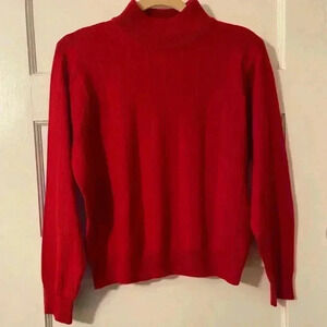 Jennifer Moore red acrylic and wool sweater with a mock turtleneck.
